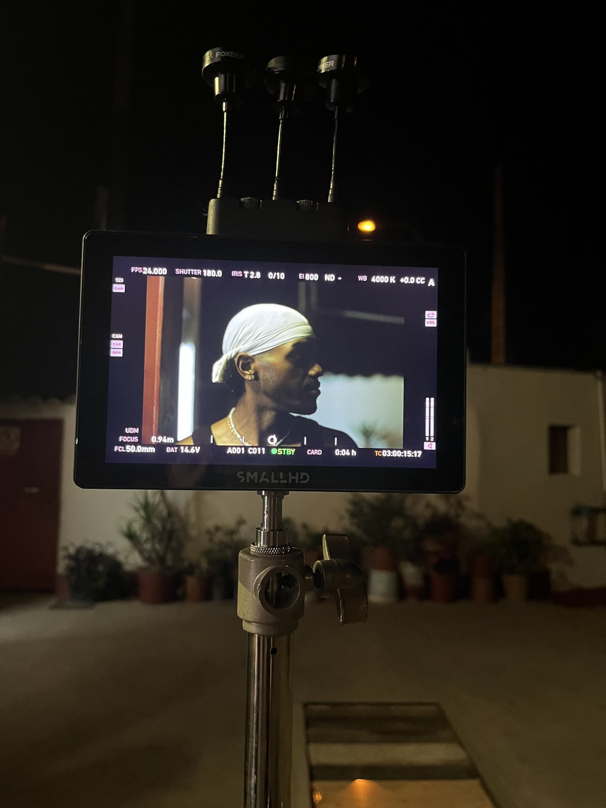 Camera monitor showing a portrait during filming