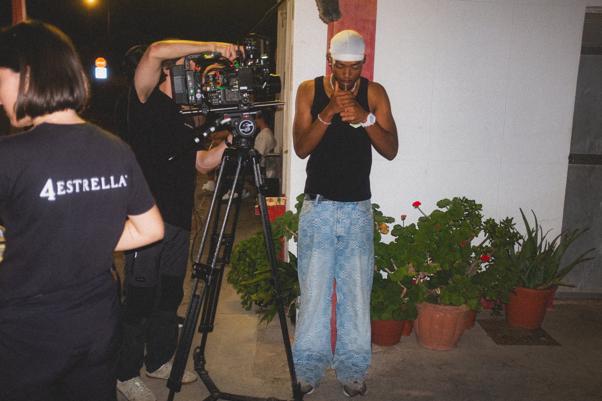 Camera operator filming on set